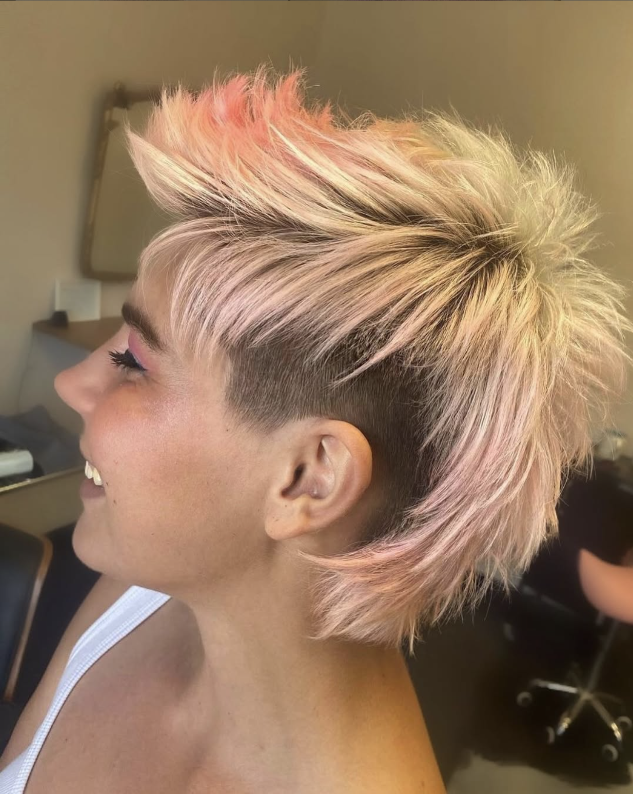 Platinum blonde and pastel pink textured cut with a side undercut